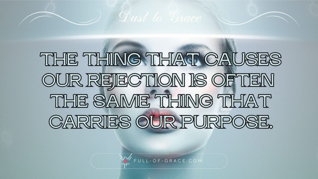 A lonely woman looking into a line of light. Her red lips contrast with the bluish background — text overlay: The thing that causes our rejection is often the same thing that carries our purpose. — Dust to Grace graphic, full-of-grace.com
