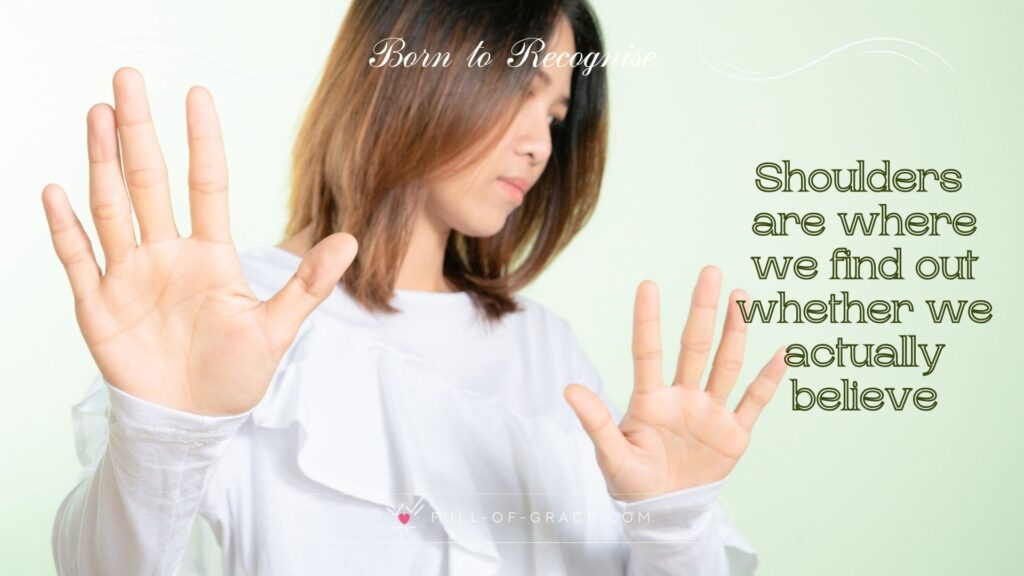 A woman expressing refusal with her hands and arms pushing away — text overlay: Shoulders are where we find out whether we actually believe — Born to Recognise graphic, full-of-grace.com